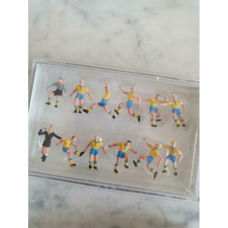 Miniatuur voetbal teams en goals