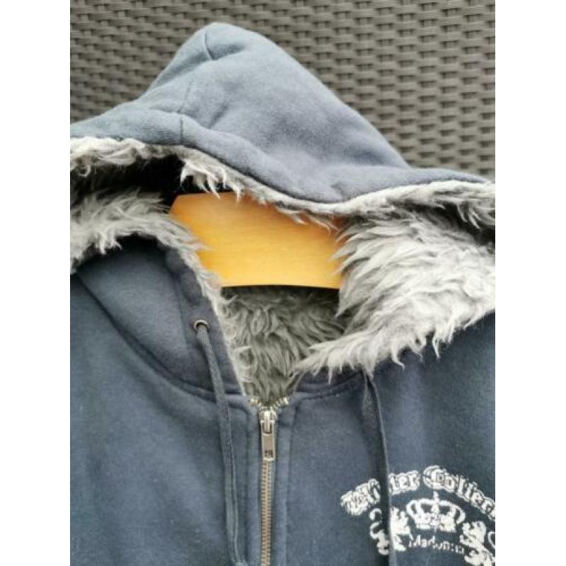 Madonna donkerblauw vest maat 38.