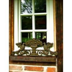 Wandornament gietijzer in de kleur green-rust-duif