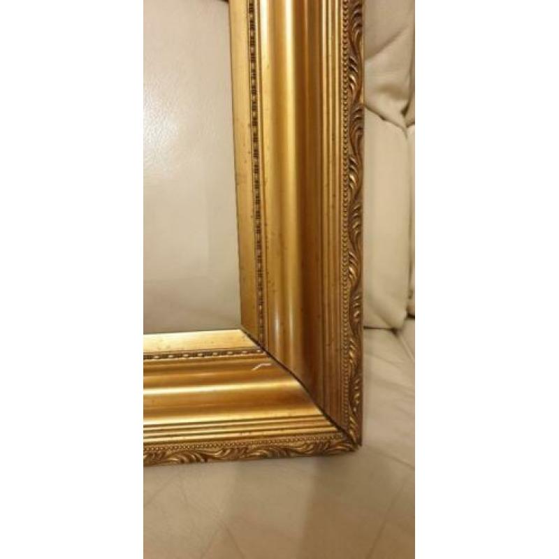 Gouden lijst,binnen maten zijn 47cm bij 73 cm.