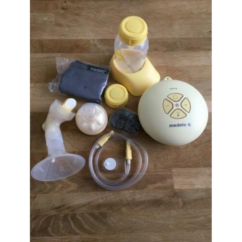 Medela Swing met extra 2x250ml, 3x150ml flessen